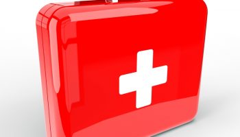 A shiny red emergency case with the white cross on the front against a white background.